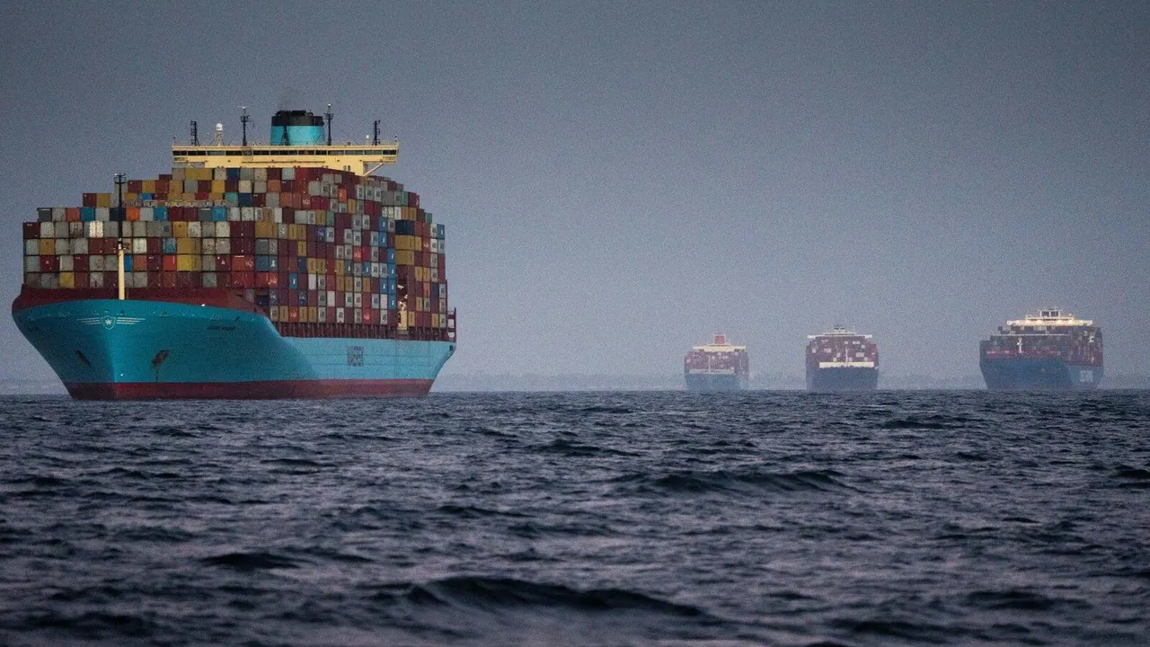 Container ships waiting offshore with stacked cargo containers
